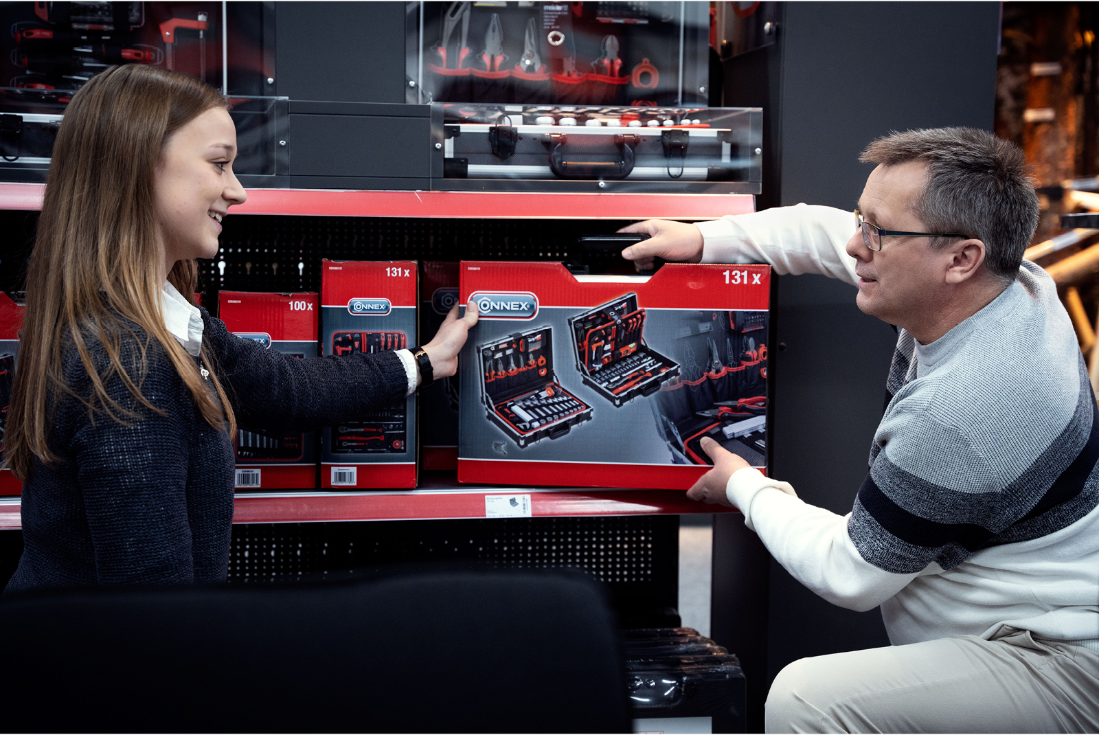 Two colleagues are talking about a toolbox Two colleagues are talking about a toolbox